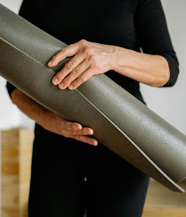 Person holding a challenging yoga balance pose, showing strength and focus.